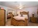 Bedroom showcasing a carved wooden bed frame with coordinating nightstands and mirrored closet at 4403 W Minnehaha St, Tampa, FL 33614