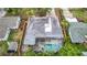 Aerial view of a home with a pool and a spa in the backyard at 4419 W El Prado Blvd, Tampa, FL 33629
