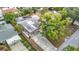 Aerial view of property with a pool, mature trees, and a convenient carport at 4419 W El Prado Blvd, Tampa, FL 33629
