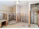 Bathroom featuring concrete block wall with walk-in shower and an exhaust fan at 4419 W El Prado Blvd, Tampa, FL 33629