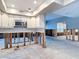 Kitchen features stainless steel microwave, white cabinets, and exposed framing at 4419 W El Prado Blvd, Tampa, FL 33629