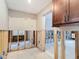 Partially renovated kitchen with exposed framing and modern brown cabinets at 4419 W El Prado Blvd, Tampa, FL 33629