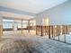 Large living room featuring exposed wall frames, concrete floors, and ample space for new design at 4419 W El Prado Blvd, Tampa, FL 33629