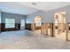 Open-concept living room and kitchen featuring exposed framing at 4419 W El Prado Blvd, Tampa, FL 33629