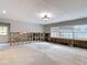 Spacious living room featuring light grey walls, concrete floors, and large windows that bring in ample natural light at 4419 W El Prado Blvd, Tampa, FL 33629