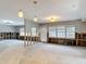Bright living room with large windows allowing ample natural light, ready for renovation at 4419 W El Prado Blvd, Tampa, FL 33629