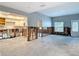 Open concept living room with new kitchen and exposed framing at 4419 W El Prado Blvd, Tampa, FL 33629