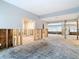 Expansive living room showcasing open layout with exposed wall frames ready for renovation and design at 4419 W El Prado Blvd, Tampa, FL 33629