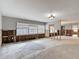 Spacious, gutted living room awaiting customization, featuring natural light and an open floor plan at 4419 W El Prado Blvd, Tampa, FL 33629