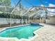 Outdoor pool area with spa, surrounded by lush greenery and brick pavers at 4419 W El Prado Blvd, Tampa, FL 33629