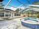 Outdoor pool area with spa and a patio in the backyard at 4419 W El Prado Blvd, Tampa, FL 33629