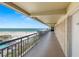 Beachfront condo hallway balcony with ocean view and exterior unit door at 4510 Gulf Blvd # 604, St Pete Beach, FL 33706