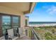 Enjoy amazing beach views from this condo's private balcony with comfortable seating at 4510 Gulf Blvd # 604, St Pete Beach, FL 33706