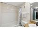 This bathroom features a shower over a tub, and granite counters, and under-cabinet storage at 4510 Gulf Blvd # 604, St Pete Beach, FL 33706