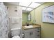 A bathroom features granite counters, a shower with glass doors, and under-cabinet storage at 4510 Gulf Blvd # 604, St Pete Beach, FL 33706