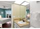 This bathroom with shower has a granite counter and is located off the main bedroom at 4510 Gulf Blvd # 604, St Pete Beach, FL 33706