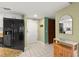 Hallway view shows kitchen, appliances and outdoor patio view at 4510 Gulf Blvd # 604, St Pete Beach, FL 33706