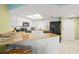 Bright kitchen featuring granite countertops and modern appliances at 4510 Gulf Blvd # 604, St Pete Beach, FL 33706