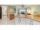 Open kitchen with updated appliances and granite countertops at 4510 Gulf Blvd # 604, St Pete Beach, FL 33706