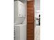 This unit has a stacked washer and dryer, located off the kitchen behind a bifold door at 4510 Gulf Blvd # 604, St Pete Beach, FL 33706