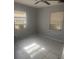 Bedroom featuring tile floors, a ceiling fan, and a window at 5211 E 17Th Ave, Tampa, FL 33619
