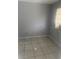 Bedroom with tile floor, window and neutral colored walls at 5211 E 17Th Ave, Tampa, FL 33619
