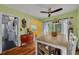 Dining area with hardwood floors and access to the kitchen at 5700 Pacific N St, St Petersburg, FL 33703