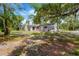 An inviting backyard showcasing a quaint single-story home with an outdoor living space at 605 Ronele Dr, Brandon, FL 33511