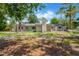 Large backyard featuring mature trees and green space, offering natural light, and privacy at 605 Ronele Dr, Brandon, FL 33511