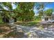 Exterior view of the home and garage, featuring a tree lined yard, offering natural light, and space at 605 Ronele Dr, Brandon, FL 33511