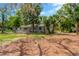Charming single-story home surrounded by mature trees and featuring a well-maintained front yard at 605 Ronele Dr, Brandon, FL 33511