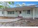Classic front porch with brick columns and walkway, offering a welcoming entrance at 605 Ronele Dr, Brandon, FL 33511