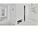 Bright hallway with white walls, leading to a sunlit room with a view at 605 Ronele Dr, Brandon, FL 33511