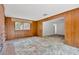 Living room featuring wood paneled walls and abundant natural light at 605 Ronele Dr, Brandon, FL 33511
