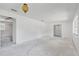 Open living room featuring neutral walls and a classic light fixture at 605 Ronele Dr, Brandon, FL 33511