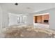 Bright living room in need of repair with a brick fireplace and built-in shelves at 605 Ronele Dr, Brandon, FL 33511