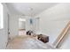 Bright room featuring white walls, light, and multiple entrances, offering natural light, and concrete floors at 605 Ronele Dr, Brandon, FL 33511