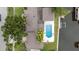 A high angle aerial view of the roof and pool at 648 Geneva Pl, Tampa, FL 33606