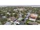 Aerial view showcases waterfront homes, lush landscaping, and a peaceful canal community at 648 Geneva Pl, Tampa, FL 33606