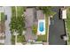 Aerial view of a home with a pool, boat lift, and canal access, showcasing the waterfront property at 648 Geneva Pl, Tampa, FL 33606