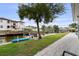 Waterfront backyard with boat dock, lush greenery, and inviting canal views for serene outdoor living at 648 Geneva Pl, Tampa, FL 33606