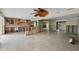 Expansive living area featuring tile flooring, natural light, and unfinished elements for a personalized design at 648 Geneva Pl, Tampa, FL 33606