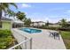 Beautiful pool area with a sunroom and waterfront view, perfect for relaxation and outdoor entertainment at 648 Geneva Pl, Tampa, FL 33606