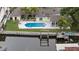 Aerial perspective highlighting a pool and a boat lift at this beautiful waterfront home at 648 Geneva Pl, Tampa, FL 33606