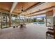 Bright sunroom with wood ceiling, brick floors, and many windows overlooking the pool and waterfront at 648 Geneva Pl, Tampa, FL 33606