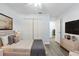 Bright bedroom featuring a comfortable bed, ample closet space, and modern decor at 6509 W Longboat Blvd, Tampa, FL 33615