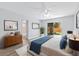 Tranquil bedroom with contemporary decor, including a comfortable bed and sliding glass door to the yard at 6509 W Longboat Blvd, Tampa, FL 33615