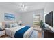 Bright bedroom featuring a comfortable bed, large window, and modern decor at 6509 W Longboat Blvd, Tampa, FL 33615