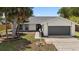 A well-maintained single-Gathering home with a nicely manicured front yard at 6509 W Longboat Blvd, Tampa, FL 33615