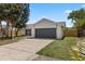 Exterior of home with a well-maintained lawn and neutral color scheme at 6509 W Longboat Blvd, Tampa, FL 33615